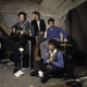 Guitarist Slim Dunlap (left), with Tommy Stinson, Mars, and Westerberg at their rehearsal space in 1989 in Minneapolis. (Photo by Paul Natkin/WireImage/Getty Images)